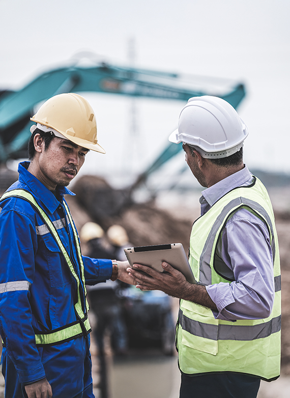 new-hampshire-contractors-reviewing-project-plans-on-a-construction-site