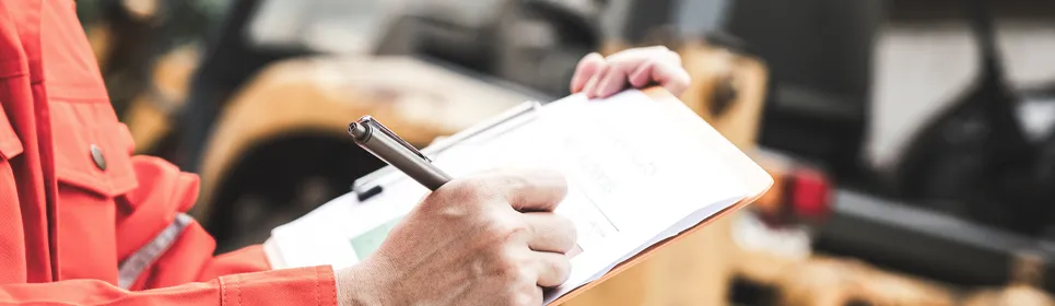 contractor working on a construction invoice